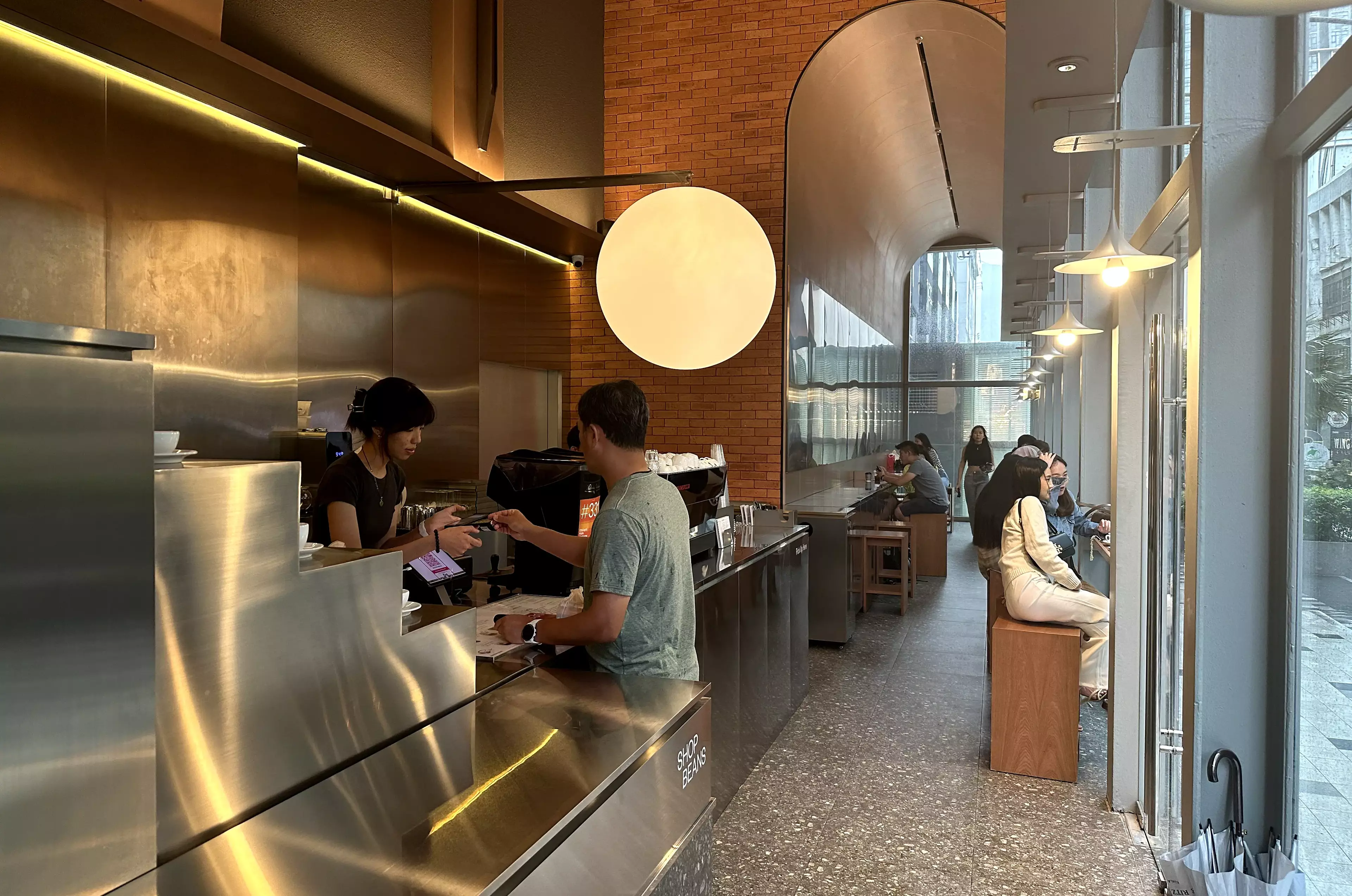 A person ordering coffee at Bean Brothers, Bukit Bintang.